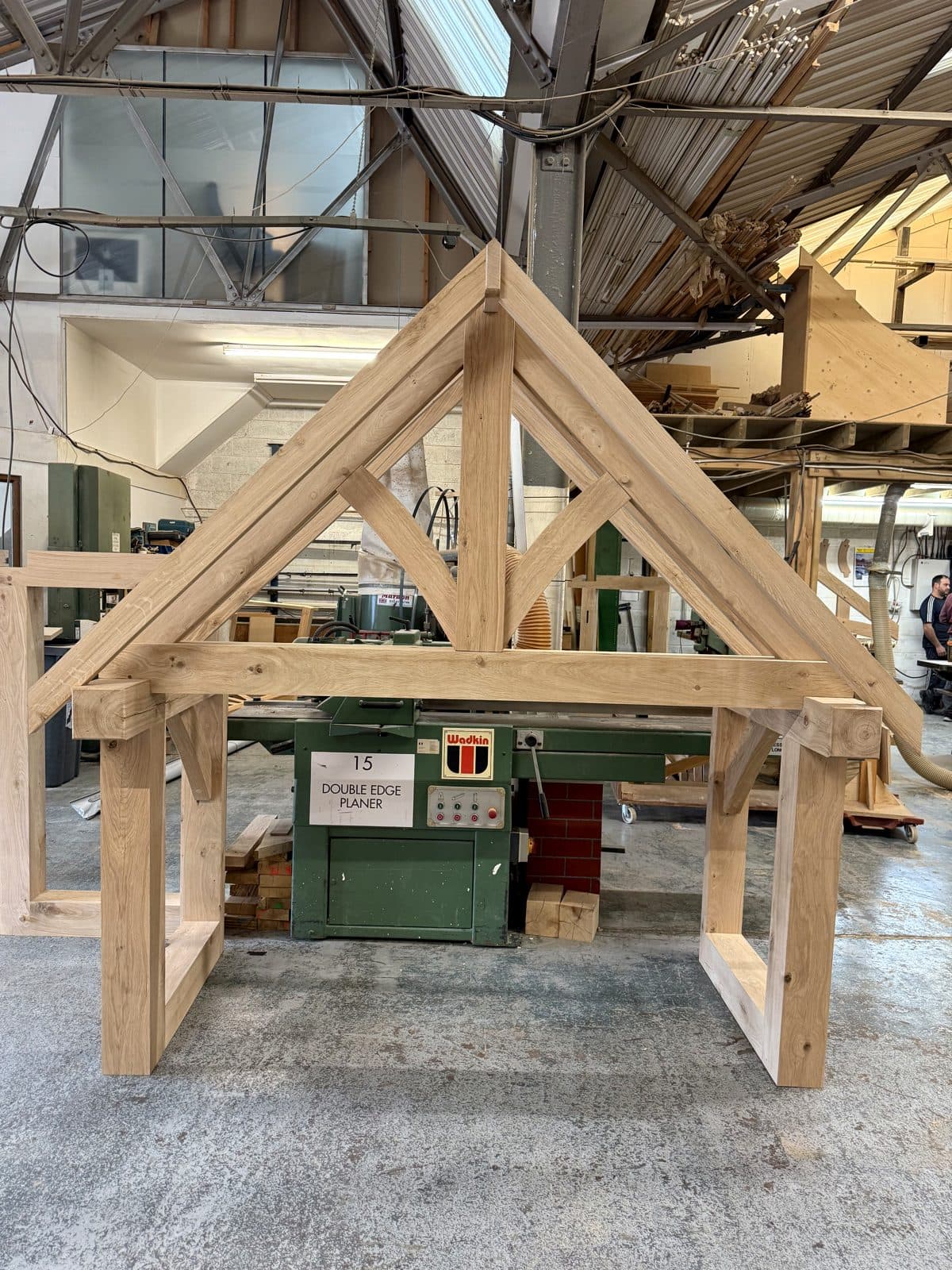 Pegged mortice and tenon joinery on a porch frame, rafters seated on the tie beam